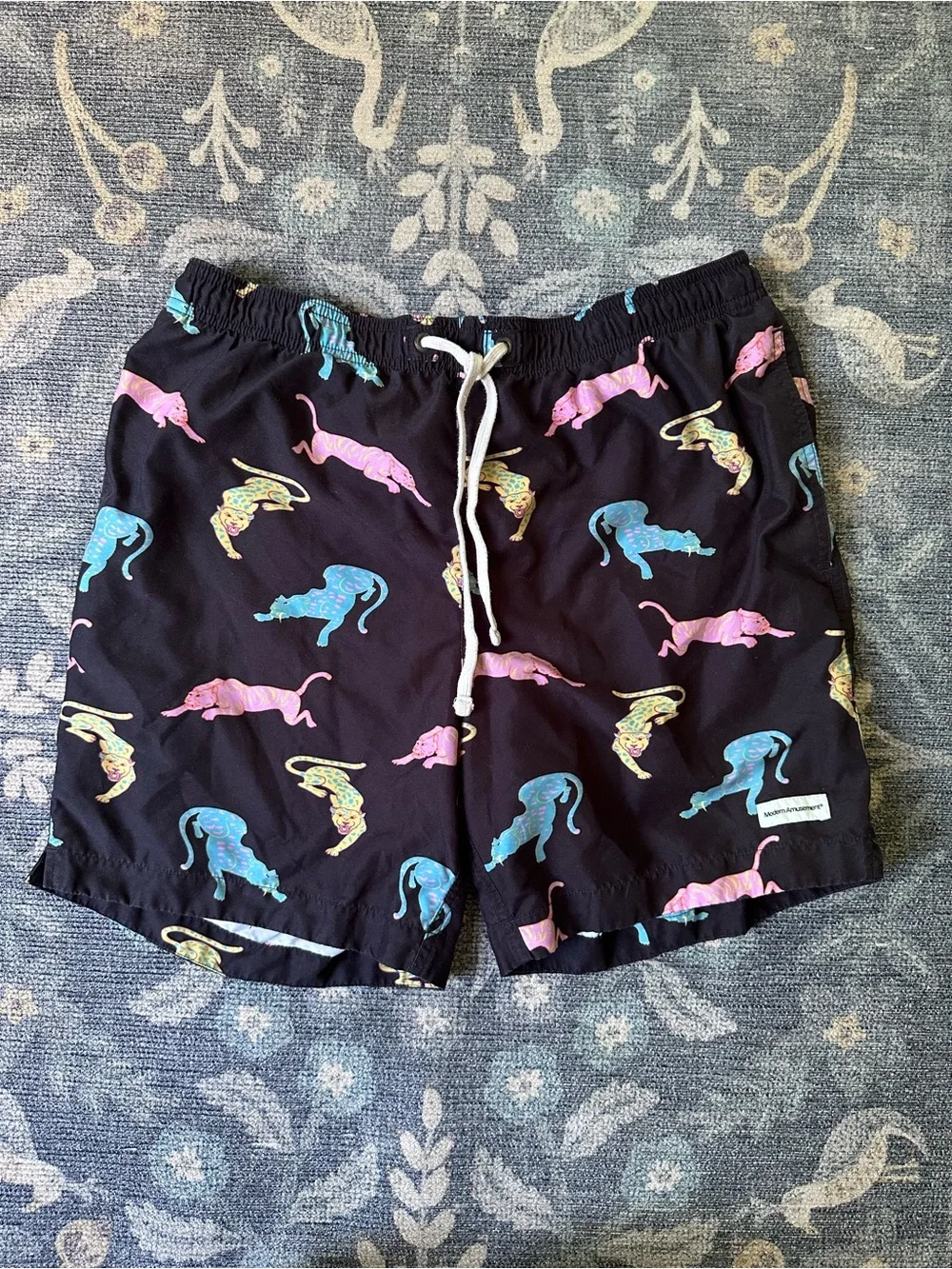 Modern Amusement Black Swim Trunks with Pink, Blue & Yellow Panther Print